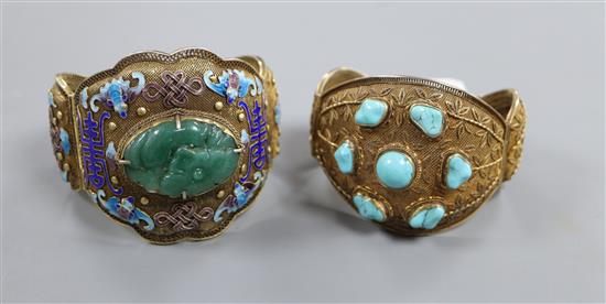 Two Chinese filligree gilt white metal hinged bangles, one set with turquoise, the other with adventurine and enamel.